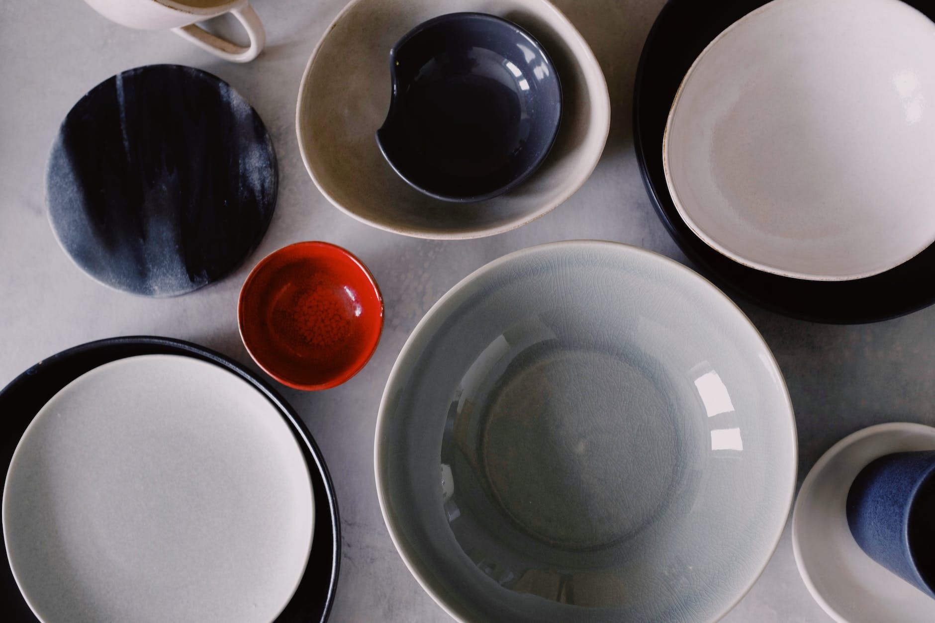 white ceramic bowl on white ceramic plate